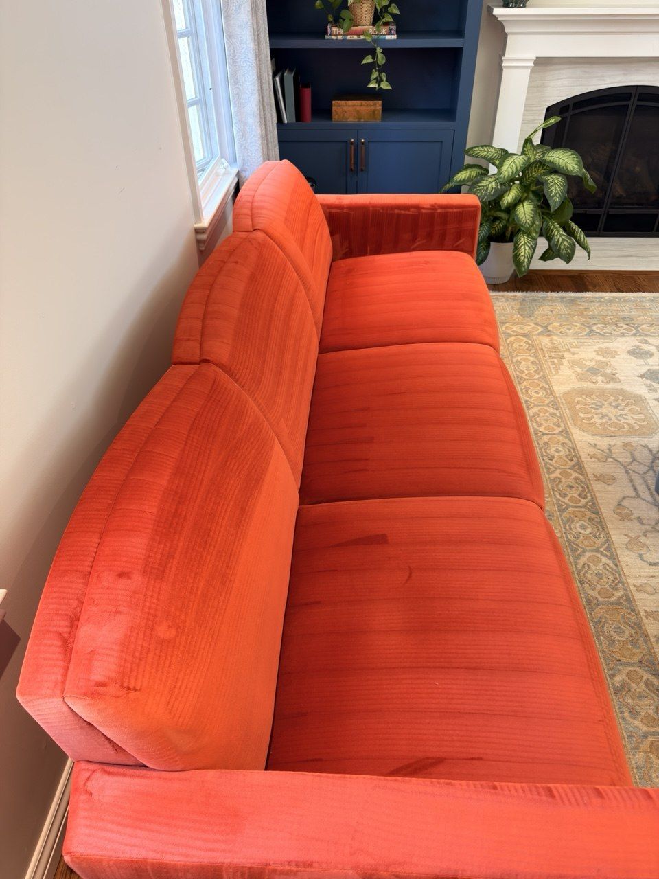 Coral velvet three-seat sofa after professional cleaning
