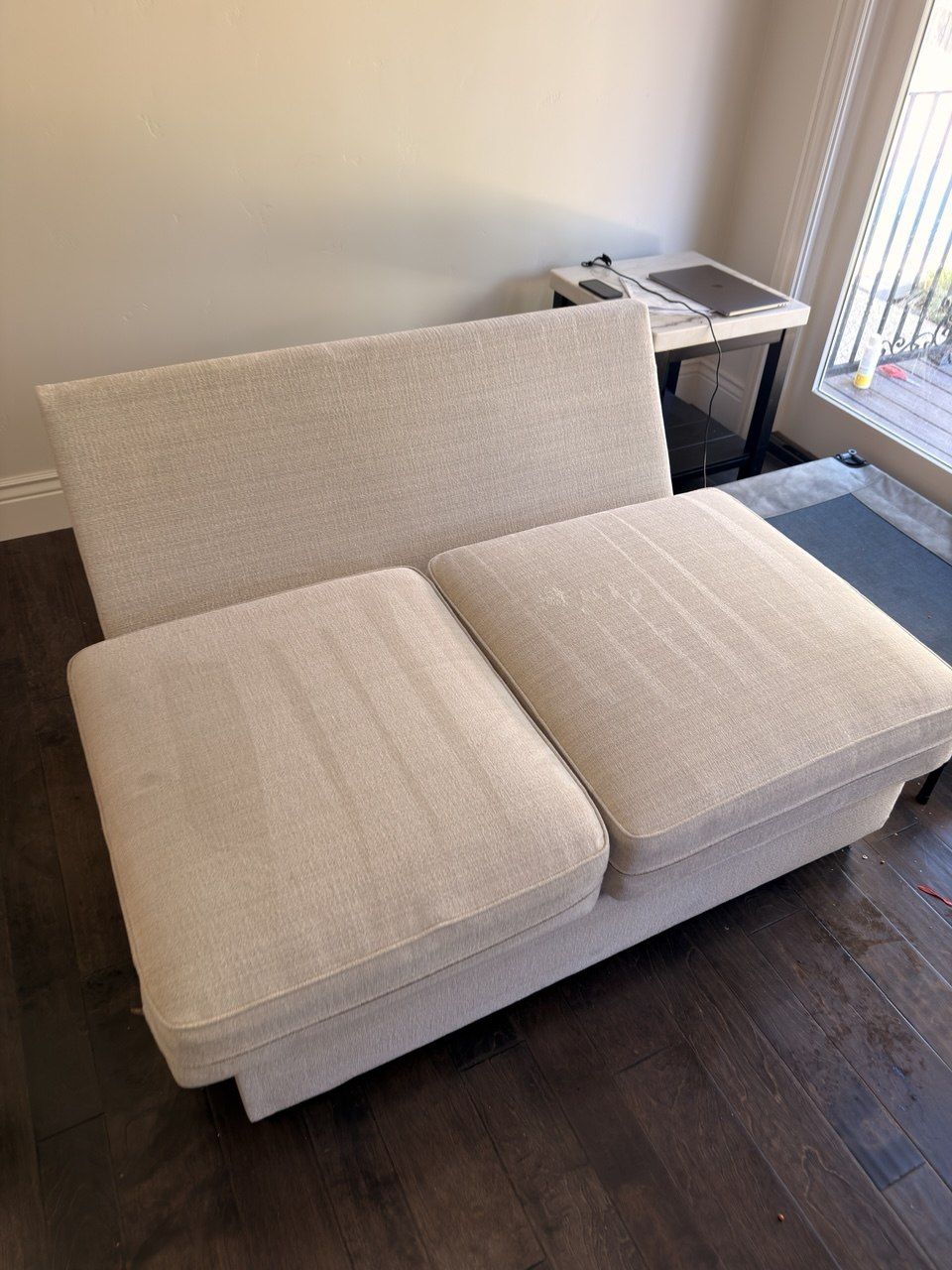Cream two-seat loveseat after cleaning