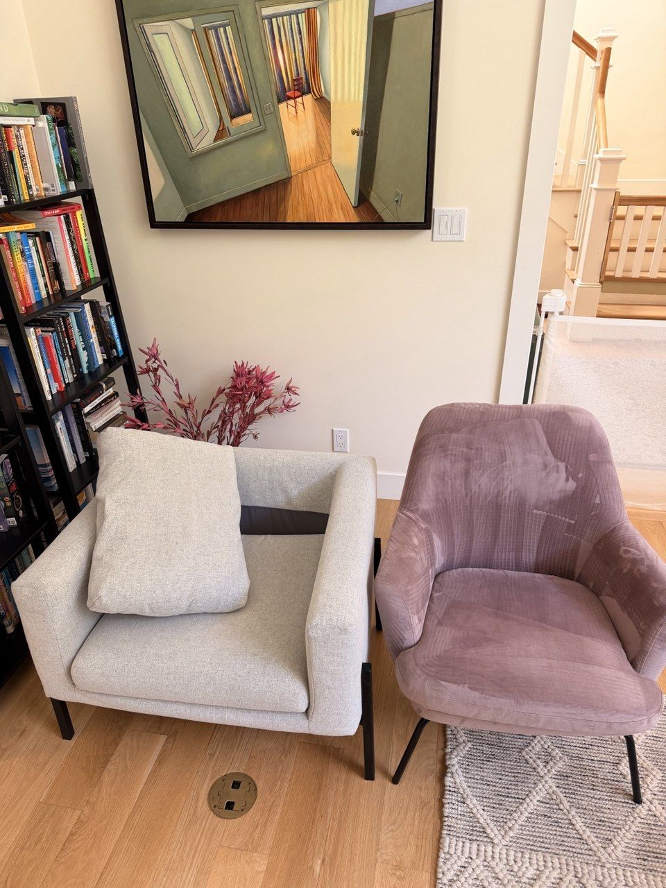 Mauve velvet accent chair mid-clean next to a light gray armchair
